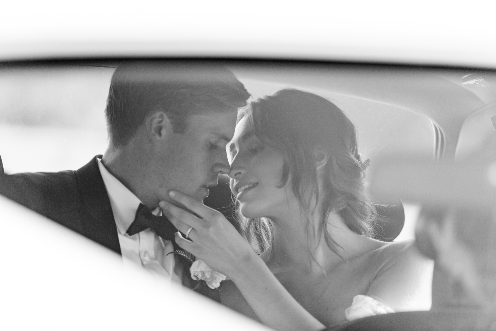 Wedding couple enjoying a moment inside of Rolls-Royce Silver Shadow